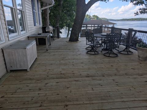 Rebuilt lakefront deck with patio furniture